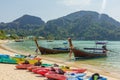 Boats and kayaks parked at the tropical bay in Thailand. Ocean. Asia. Sunny day. Royalty Free Stock Photo