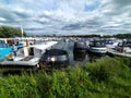 Boats in lake with neverending blue sky