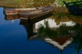 Boats in the lake with reflection of a building in water Royalty Free Stock Photo