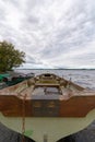 boats on the lake shore with low cloudy sky