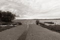 boats on the lake shore with low cloudy sky