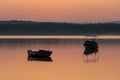 Boats on the lake at sunrise. Tranquil nature scene landscape Royalty Free Stock Photo