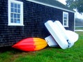 Boats Leaning on Garage