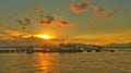 Boats leaning on the harbor at sunset