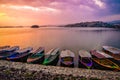 Boats leaning on the shore of the lake in the morning