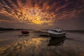 Boats lie high and dry on the shore at Sandbanks