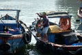 Boats and Lifestyle at Qui Nhon Fish Port, Vietnam in the morning. Royalty Free Stock Photo