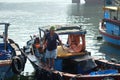 Boats and Lifestyle at Qui Nhon Fish Port, Vietnam in the morning. Royalty Free Stock Photo