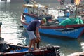 Boats and Lifestyle at Qui Nhon Fish Port, Vietnam in the morning. Royalty Free Stock Photo