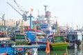 Boats and Lifestyle at Qui Nhon Fish Port, Vietnam in the morning. Royalty Free Stock Photo