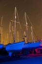 Boats light painted with star trails