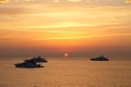 Boats in the Ligurian sea at sunrise Royalty Free Stock Photo