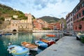 Boats line the small harbor of the colorful, picturesque village of Vernazza, Italy, one of the Cinque Terre villages