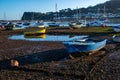 Boats on a bright winter\'s afternoon where the estuary meets the sea in Teignmouth. Colourful fishing, rowing boats. Royalty Free Stock Photo