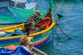 Boats and a local fisherman in the bay of Msida