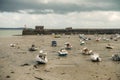 Boats lying on the sea floor at low tide near Granville