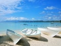 Boats, lying on a white sandy beach on Guadeloupe in the Caribbean Royalty Free Stock Photo