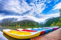 Boats on majestic mountain lake Lacul Rosu or Red Lake or Killer Lake