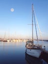 Boats in a marina at full moon Royalty Free Stock Photo