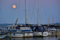 Boats in a marina on the island of Ãâ rÃÂ¸, Denmark at full moon Royalty Free Stock Photo