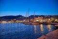 Boats in marina at sunset.