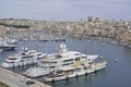 Boats moored alongside Fort Saint Angelo in Valetta, Malta Royalty Free Stock Photo