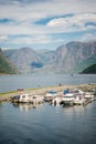 boats moored in calm harbour and majestic mountain landscape Aurlandsfjord Flam
