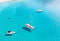 Boats anchored on calm turquoise sea water background, aerial drone view Royalty Free Stock Photo