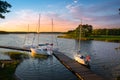 Boats moored at the gangplank on the Kirsajty Lake, Masuria Royalty Free Stock Photo