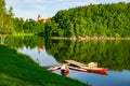 Boats moored on Lesna lake near Czocha Castle at sunny summer morning , Lower Silesia, Poland Royalty Free Stock Photo