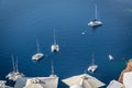 Boats moored in the old volcanic caldera in Santorini Royalty Free Stock Photo