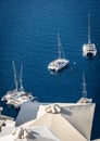 Boats moored in the old volcanic caldera in Santorini Royalty Free Stock Photo