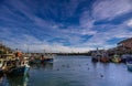 Boats moored in Scarborough Harbour on a sunny autumn day.