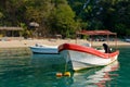 Boats moored by scenic beach