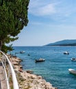 Boats moored by seashore in Rabac, Croatia Royalty Free Stock Photo