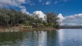 The boats are moored at the shore of a calm lake. Royalty Free Stock Photo