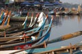 Boats moored at Taungthaman Lake near Amarapura in Myanmar by the U Bein Bridge Royalty Free Stock Photo