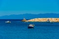 Boats mooring alongside Koroni castle in Greece