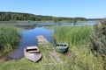 Boats at the mooring bridge , Karakan River, Novosibirsk region, Russia Royalty Free Stock Photo