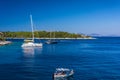8.27.2014 - Boats near old lighthouse in Fiscardo village. Kefalonia island, Greece Royalty Free Stock Photo