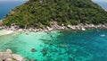 Boats near small islands. Motor dive boats floating on calm blue sea near unique small islets connected with white beaches and