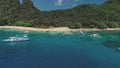 Boats on ocean bay aerial view at sand beach. Tropical jungle forest on mountain island El Nido Royalty Free Stock Photo