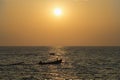 Boats in ocean at sunset Royalty Free Stock Photo