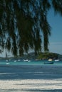 Boats off Cote D'Or in the evening light off the Seychelles. Royalty Free Stock Photo