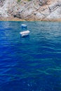 Boats over blue water in a cove near the town of Praiano, along the Amalfi Coast, Italy Royalty Free Stock Photo