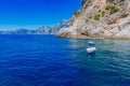 Boats over blue water in a cove near the town of Praiano, along the Amalfi Coast, Italy Royalty Free Stock Photo