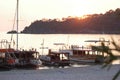 Boats parked at the habor during sunset.