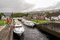 Boats parked between the locks and people waiting to enter the Caledonian Canal in Fort Augustus near Loch Ness, Scotland