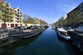 Boats parked at the quays on the  main channe in the Christianshavn district in a sunny day in Copenhagen, Denmark. Royalty Free Stock Photo