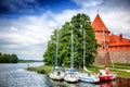 Boats parked on the shore of the lake near Trakai Castle in Lithuania, travel to the Baltic States Royalty Free Stock Photo